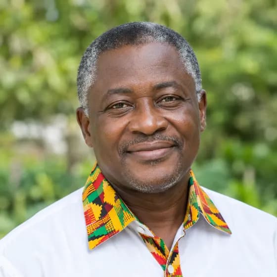 Sample portrait: an older man in a shirt with a kente collar